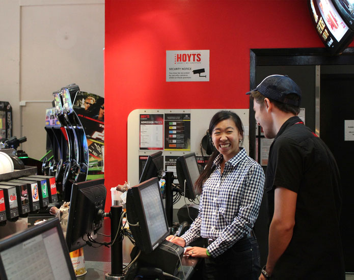 Hoyts employee engaging with Proto member of staff at the ticket register