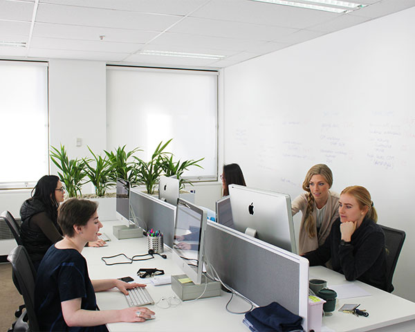 Proto Partners team collaborating in the Sydney studio