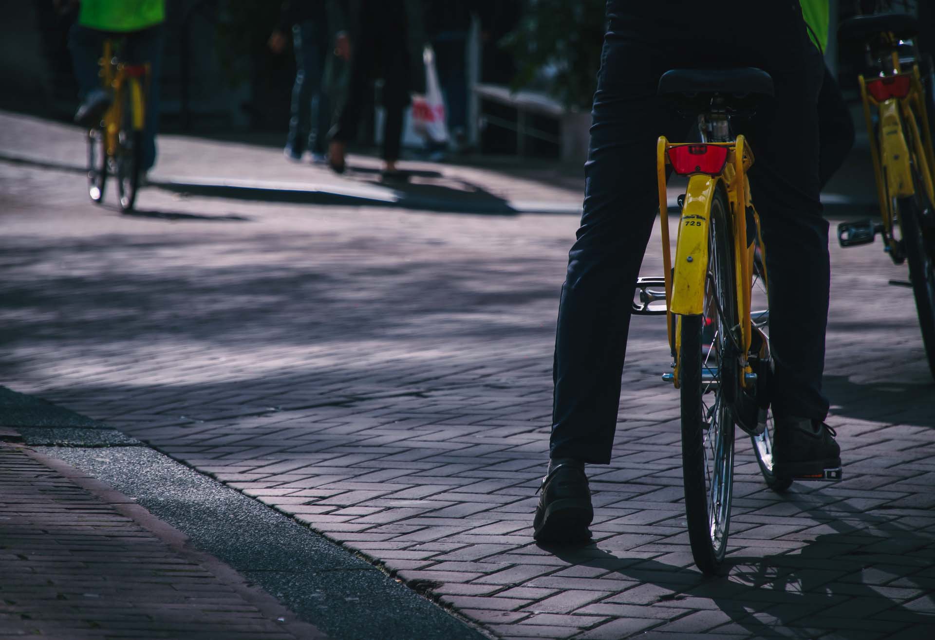 Bike riders peddling down the street represented Biker-centered design in Denmark