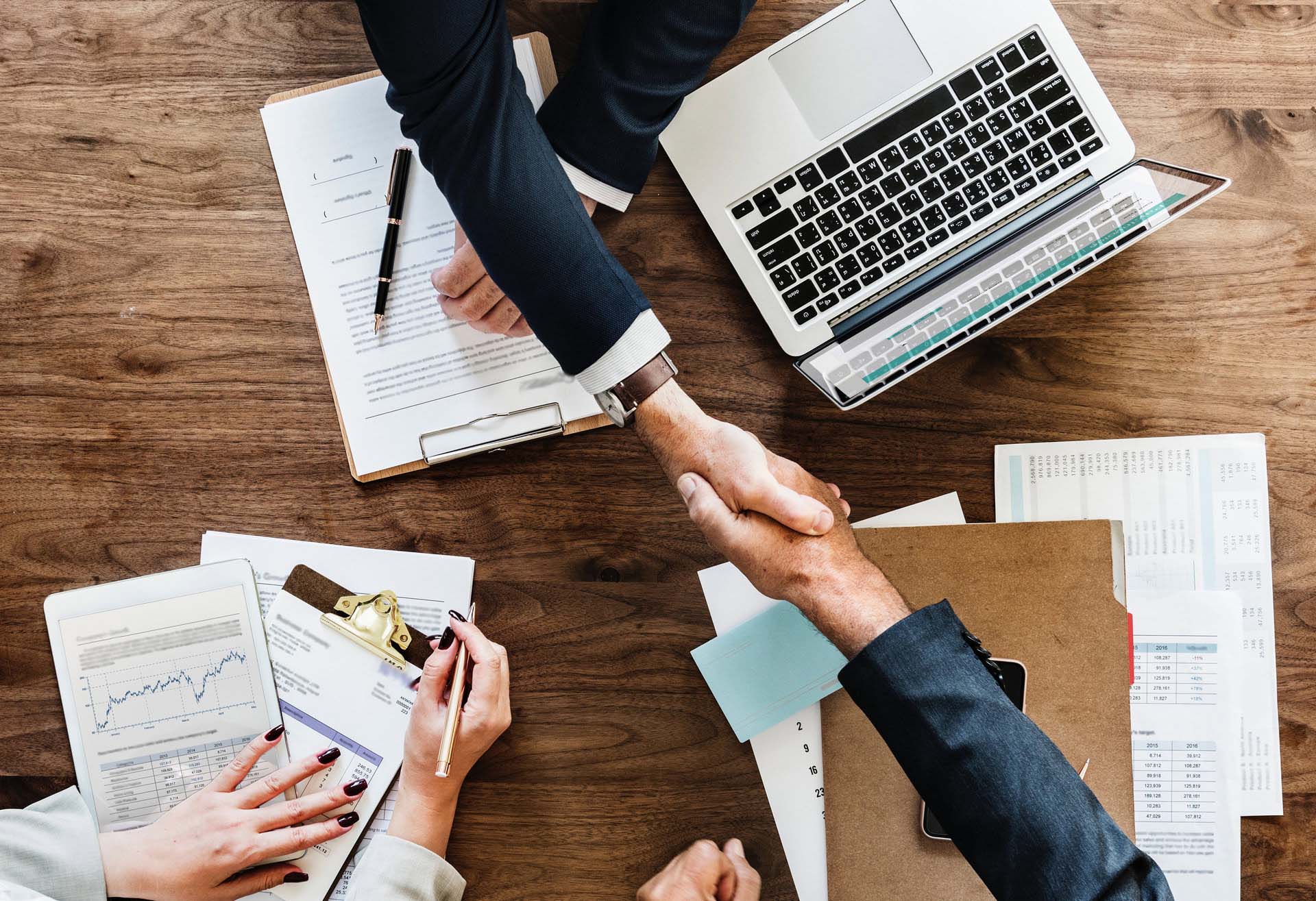 People shaking hands in a business meeting
