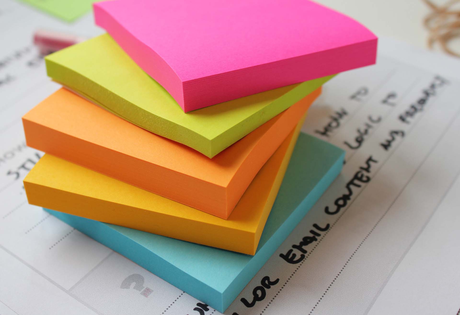 Stacked coloured notepads customer workshop preperation