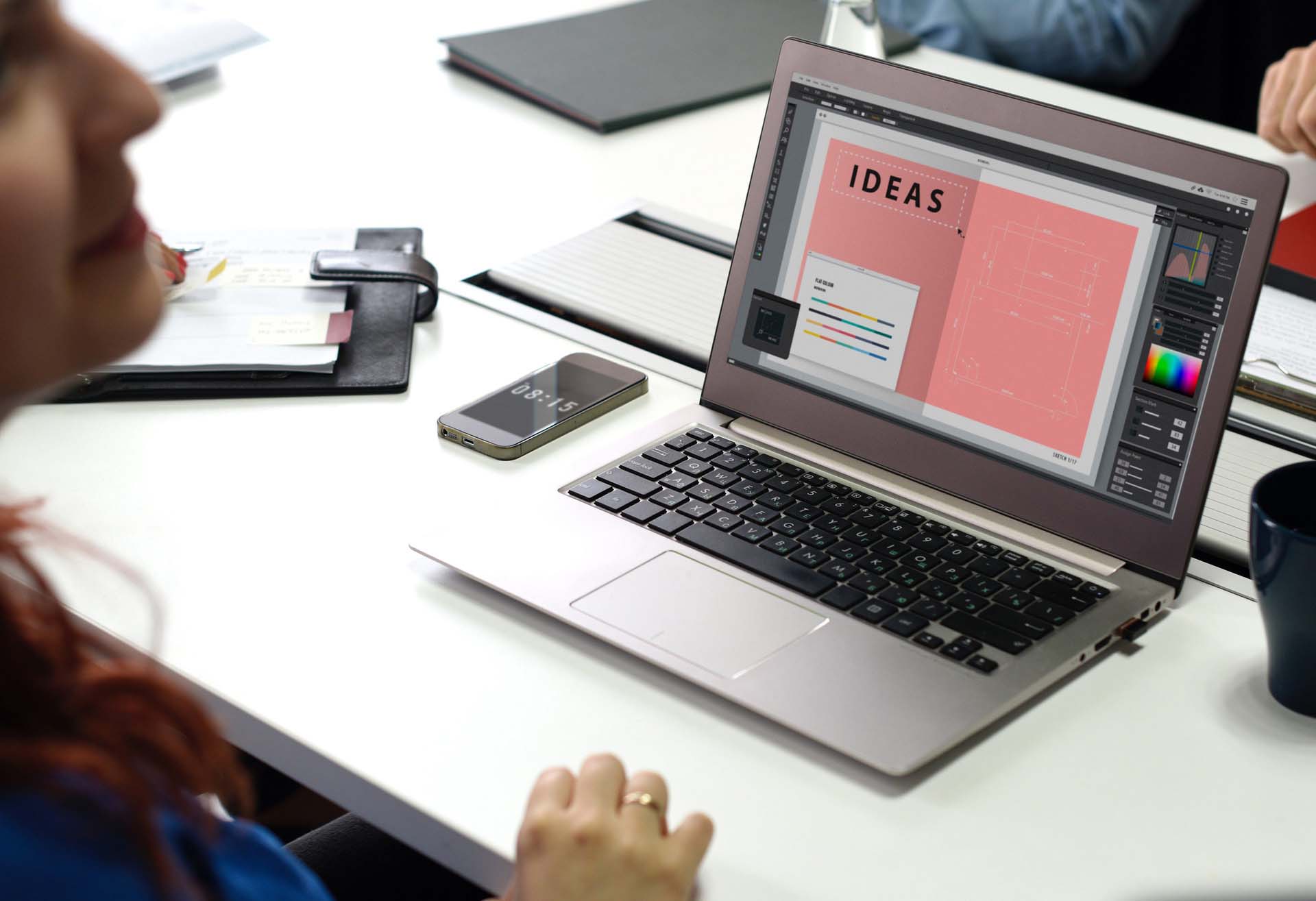 Laptop on a desk with a designers Ideas template on the screen