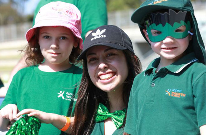 Photo of aspect staff with children