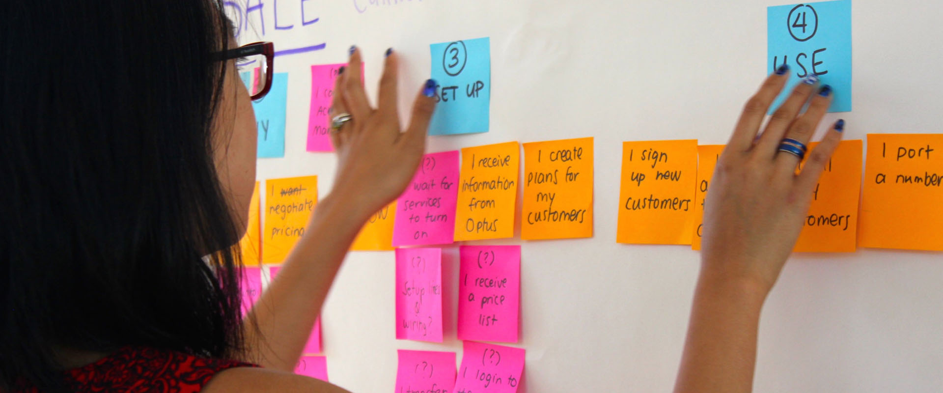 Proto experience designer putting notes on a Customer Journey Map draft