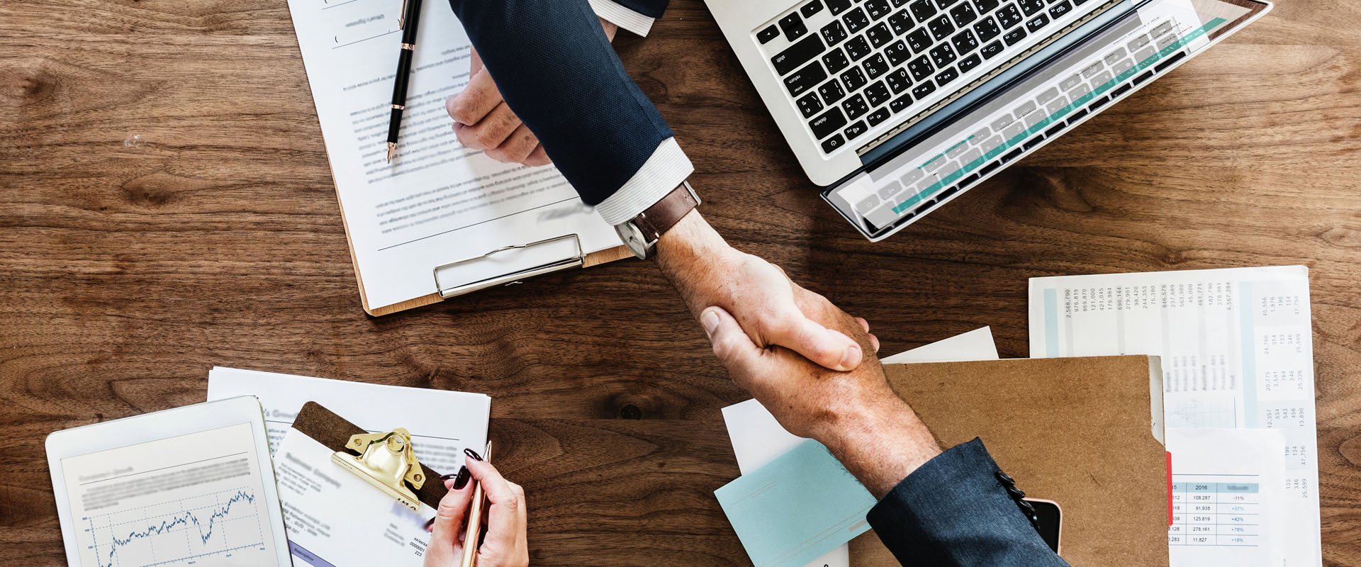 People shaking hands in a business meeting