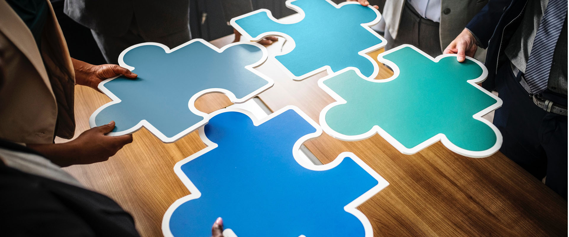 Four puzzle pieces representing the four stages of Service Design
