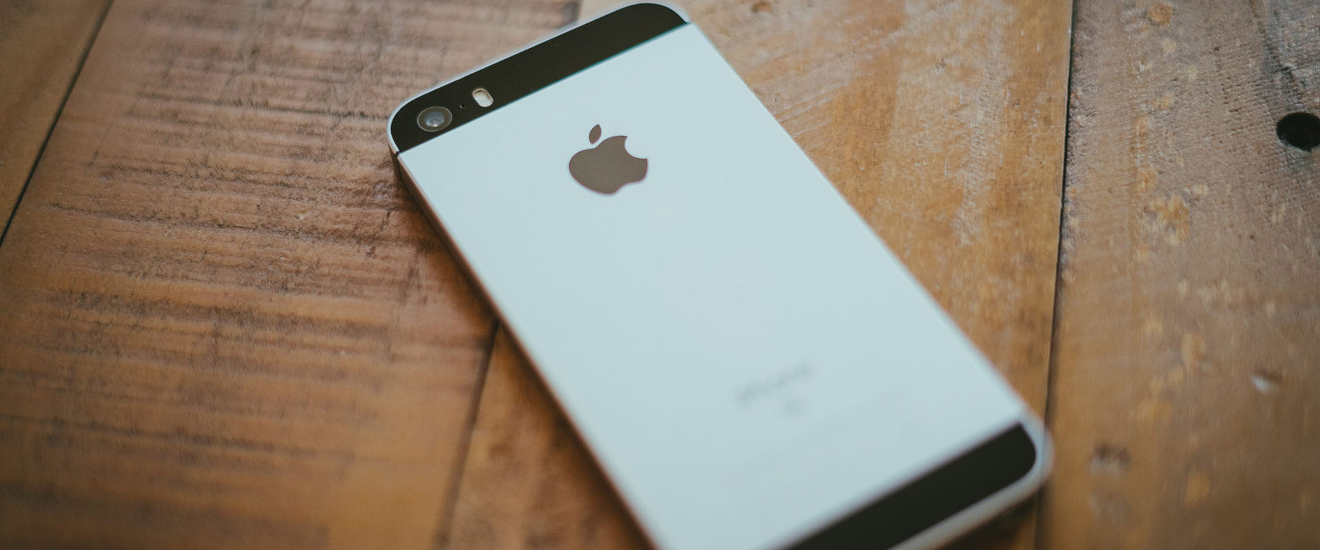 Apple iPhone face down on table representing a great example of brand discipline