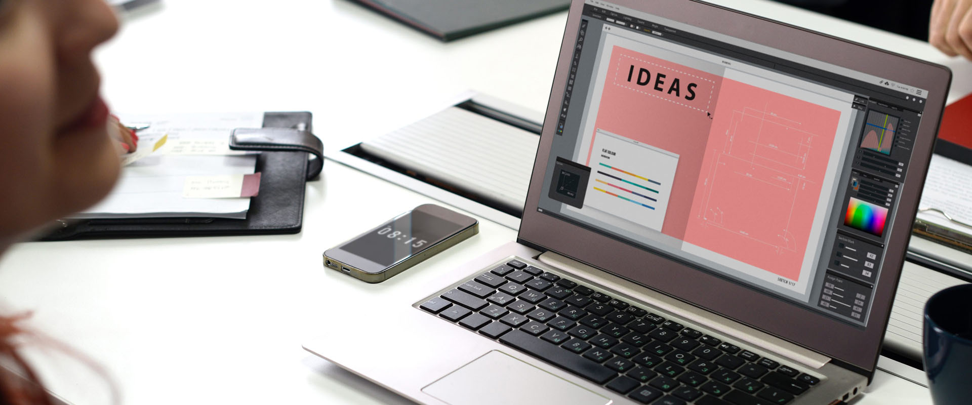 Laptop on a desk with a designers Ideas template on the screen