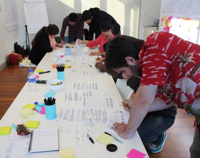 Group of people participating in customer research workshop