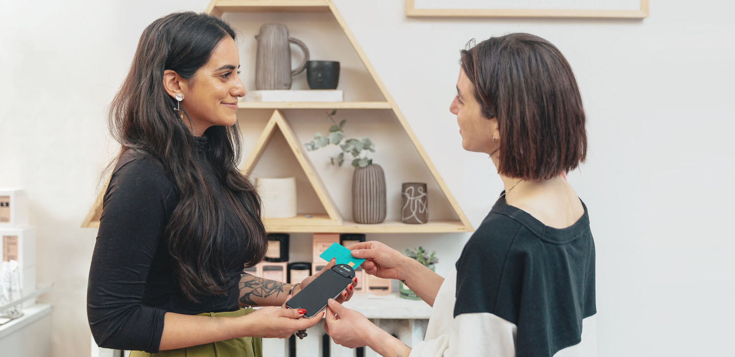 Happy customer making a transaction in a small boutique shop