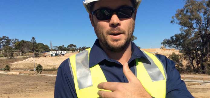 Transport worker participating in customer research gesturing to camera